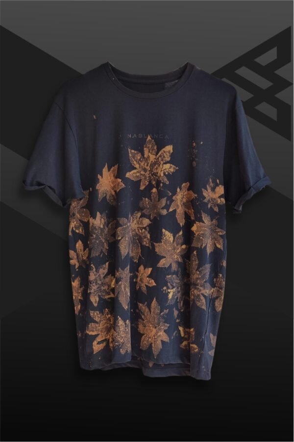 an image of a black t-shirt with copper colored leaf graphics over it