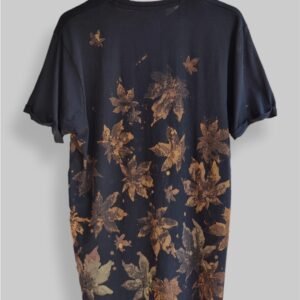 an image of a black t-shirt with copper colored leaf graphics over it