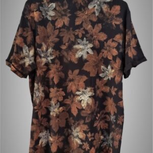 an image of a black t-shirt with copper colored leaf graphics over it