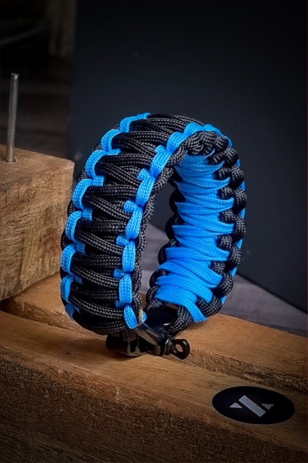 double layer handmade paracord bracelet made with sky blue and black paracord with shackle buckle