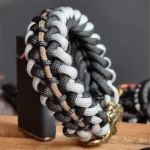 mythical Bear tribal buckle paracord bracelet with silver, gold and black paracord