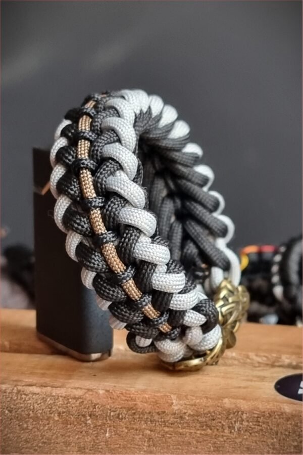 mythical Bear tribal buckle paracord bracelet with silver, gold and black paracord