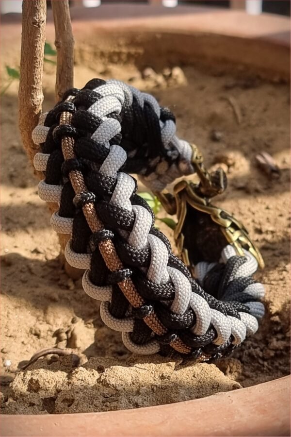 mythical Bear tribal buckle paracord bracelet with silver, gold and black paracord