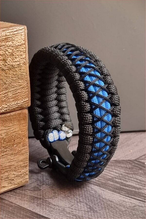 handmade survival paracord bracelet made of black, light blue paracords with shackle buckle