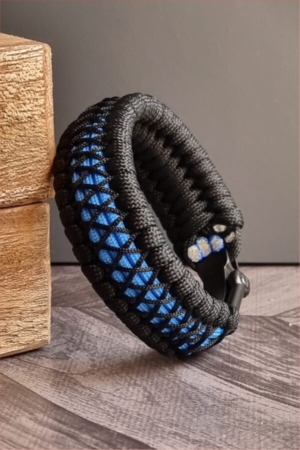 handmade survival paracord bracelet made of black, light blue paracords with shackle buckle