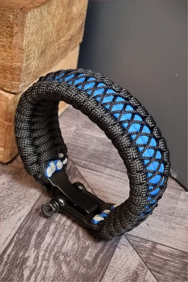 handmade survival paracord bracelet made of black, light blue paracords with shackle buckle