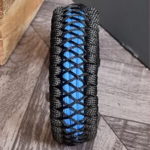 handmade survival paracord bracelet made of black, light blue paracords with shackle buckle