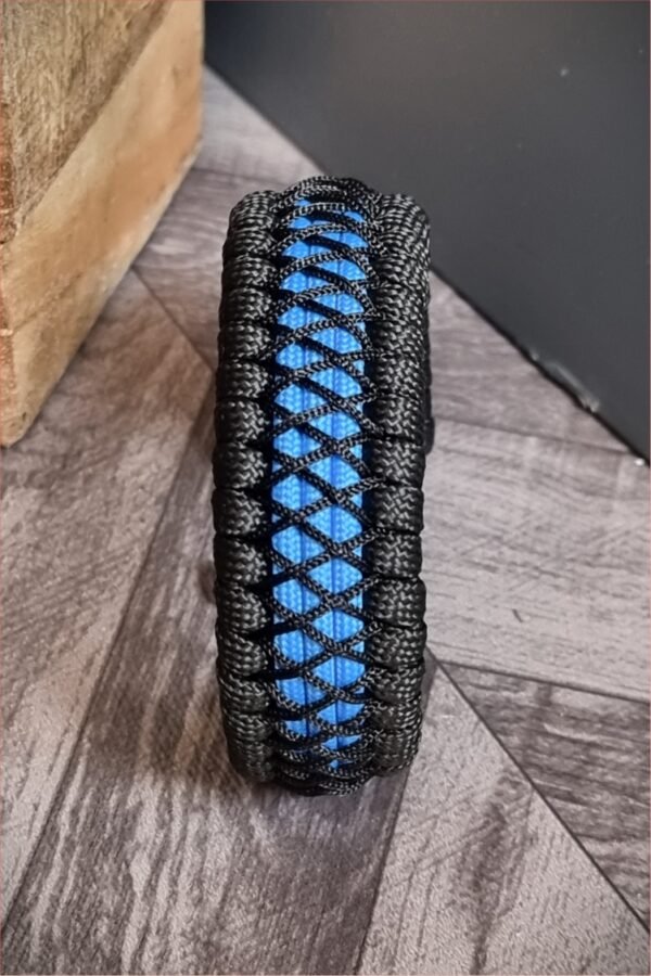 handmade survival paracord bracelet made of black, light blue paracords with shackle buckle