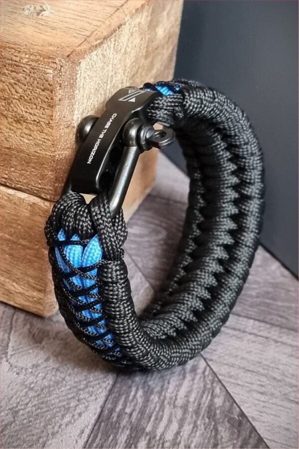 handmade survival paracord bracelet made of black, light blue paracords with shackle buckle