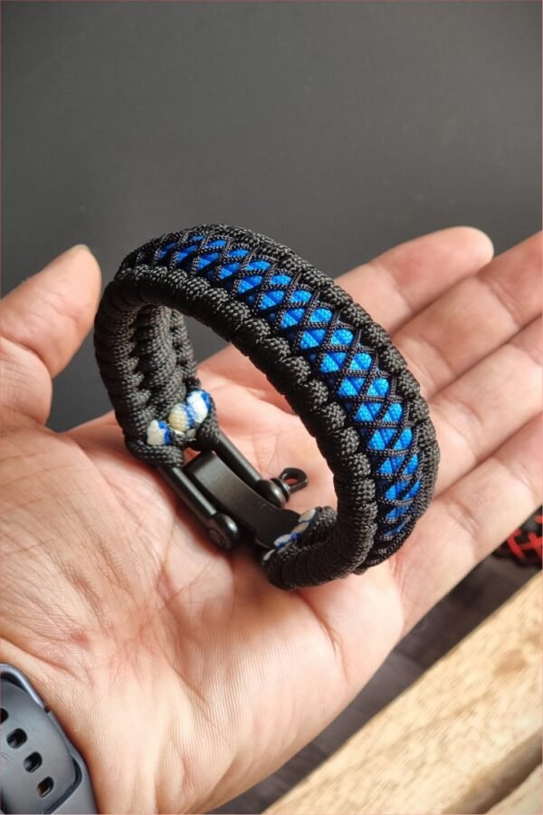 handmade survival paracord bracelet made of black, light blue paracords with shackle buckle