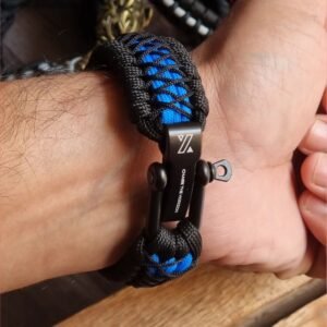 handmade survival paracord bracelet made of black, light blue paracords with shackle buckle