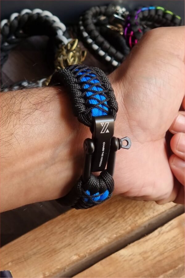 handmade survival paracord bracelet made of black, light blue paracords with shackle buckle