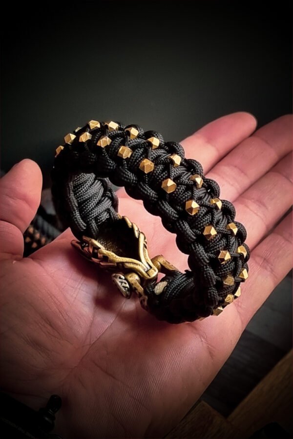 mythical Bear tribal buckle paracord bracelet with silver, gold and black paracord