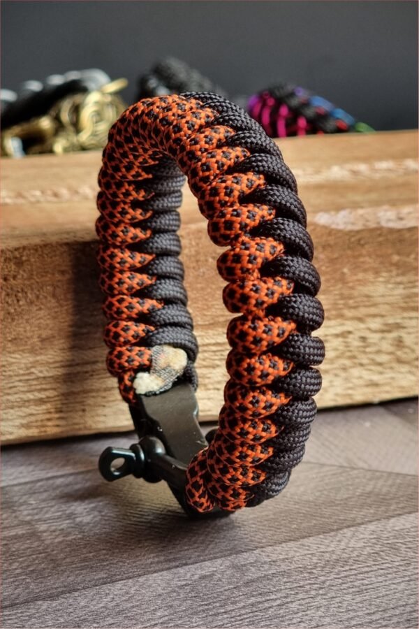 handmade paracord bracelet made with orange camo and black paracord 550 with shackle buckle