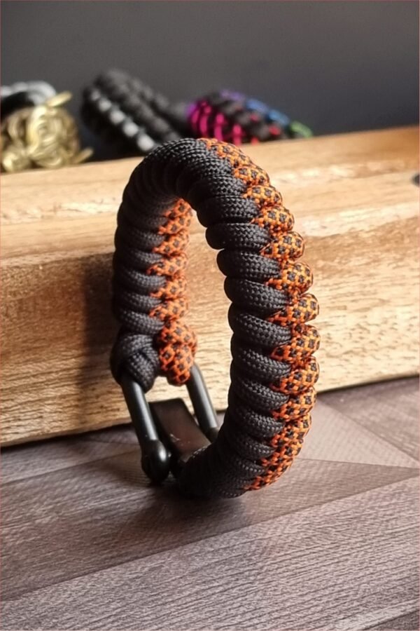 handmade paracord bracelet made with orange camo and black paracord 550 with shackle buckle