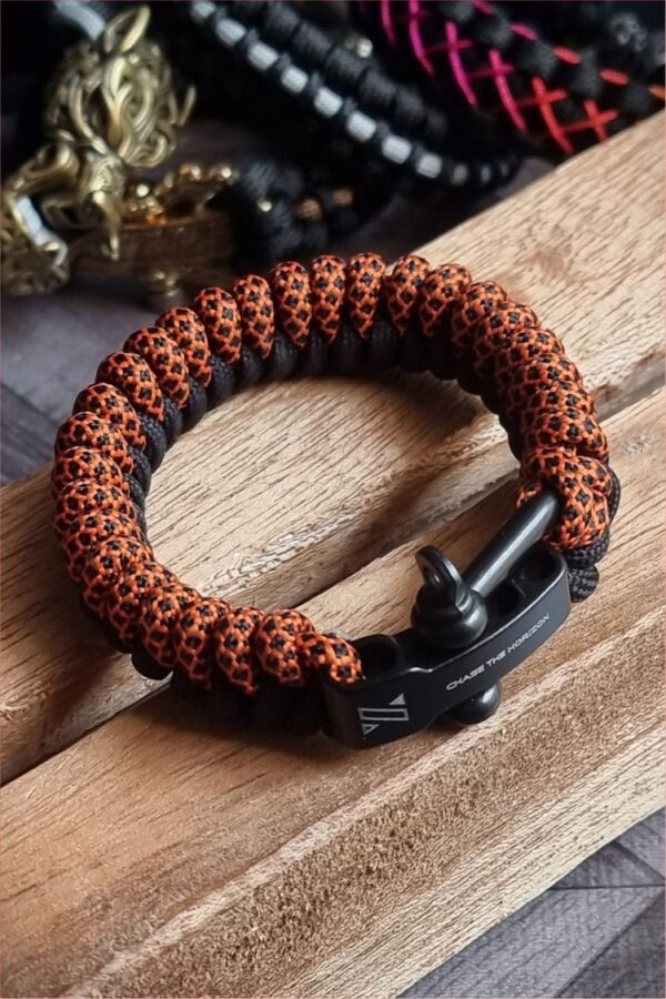 handmade paracord bracelet made with orange camo and black paracord 550 with shackle buckle