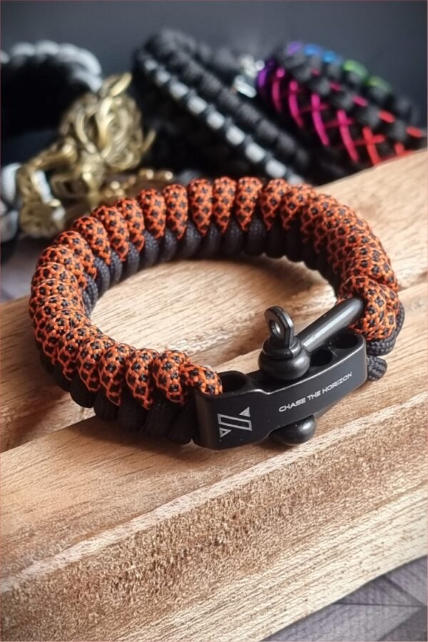 handmade paracord bracelet made with orange camo and black paracord 550 with shackle buckle