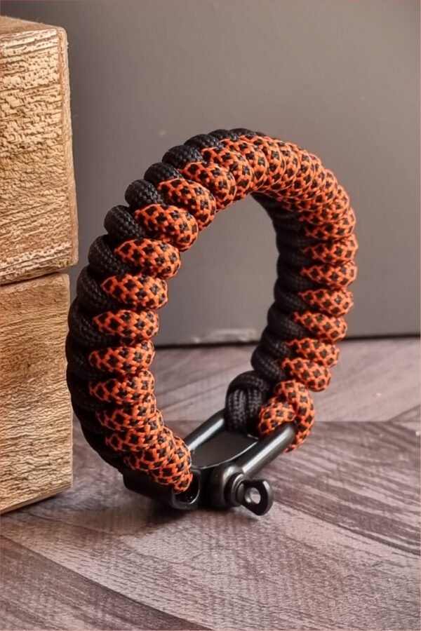 handmade paracord bracelet made with orange camo and black paracord 550 with shackle buckle