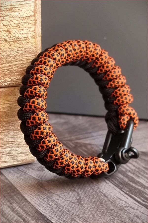 handmade paracord bracelet made with orange camo and black paracord 550 with shackle buckle