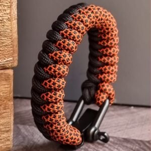 handmade paracord bracelet made with orange camo and black paracord 550 with shackle buckle