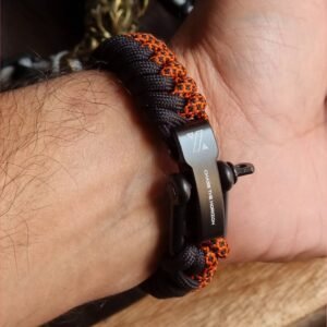 handmade paracord bracelet made with orange camo and black paracord 550 with shackle buckle