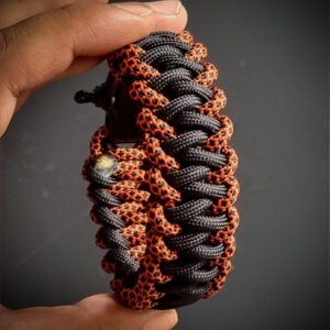 handmade stitched paracord bracelet made with 4mm black, purple, orange camo paracords, with brass adjustable shackle buckle