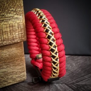 handmade paracord bracelet from Red and golden paracord type 3 with adjustable shackle buckle