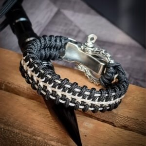 Handmade paracord bracelet with Black 4mm paracord and off white micro cord with adjustable tribal Egyptian shackle buckle