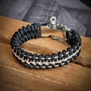 Handmade paracord bracelet with Black 4mm paracord and off white micro cord with adjustable tribal Egyptian shackle buckle