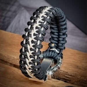 Handmade paracord bracelet with Black 4mm paracord and off white micro cord with adjustable tribal Egyptian shackle buckle