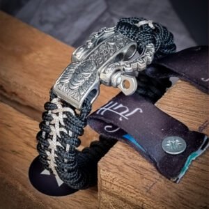 Handmade paracord bracelet with Black 4mm paracord and off white micro cord with adjustable tribal Egyptian shackle buckle