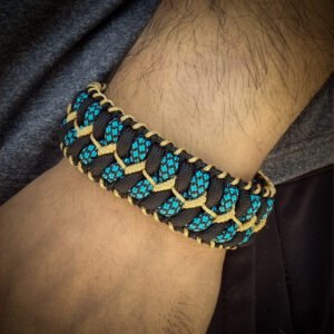 handmade stitched paracord bracelet with intricate designs using Black, Blue camo and golden paracord with adjustable silver brass tribal buckle