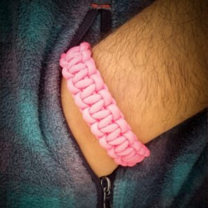 handmade stitched adjustable pink paracord bracelet which resembles Tom Hardy's paracord bracelet from the movie Mad Max Fury Road