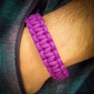 handmade stitched adjustable purple paracord bracelet which resembles Tom Hardy's paracord bracelet from the movie Mad Max Fury Road