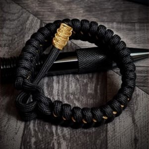 handmade paracord bracelet Adjustable made with black paracord 550 and Golden Micro cord