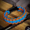 handmade paracord bracelet with adjustable shackle buckle in Delhi Capitals Jersey Theme sky blue and orange color IPL Merchandise