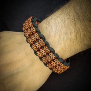 premium handmade track knot paracord bracelet in diamond orange and black paracord with adjustable shackle buckle