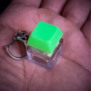 green mechanical keyboard single key keychain with light for stress relieving