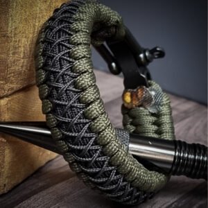premium handmade paracord 550 bracelet with green and black paracord with black micro cord web design and adjustable shackle buckle
