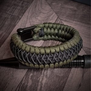 premium handmade paracord 550 bracelet with green and black paracord with black micro cord web design and adjustable shackle buckle