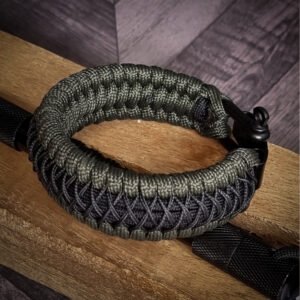 premium handmade paracord 550 bracelet with green and black paracord with black micro cord web design and adjustable shackle buckle