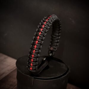 Paracord bracelet with micro-cord stitching with thin red line style