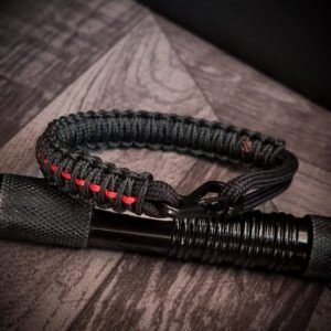 Paracord bracelet with micro-cord stitching with thin red line style
