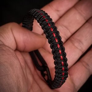 Paracord bracelet with micro-cord stitching with thin red line style