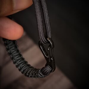 Paracord bracelet with micro-cord stitching with thin red line style