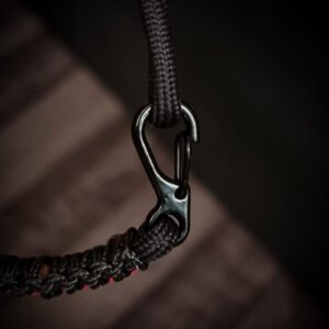 Paracord bracelet with micro-cord stitching with thin red line style